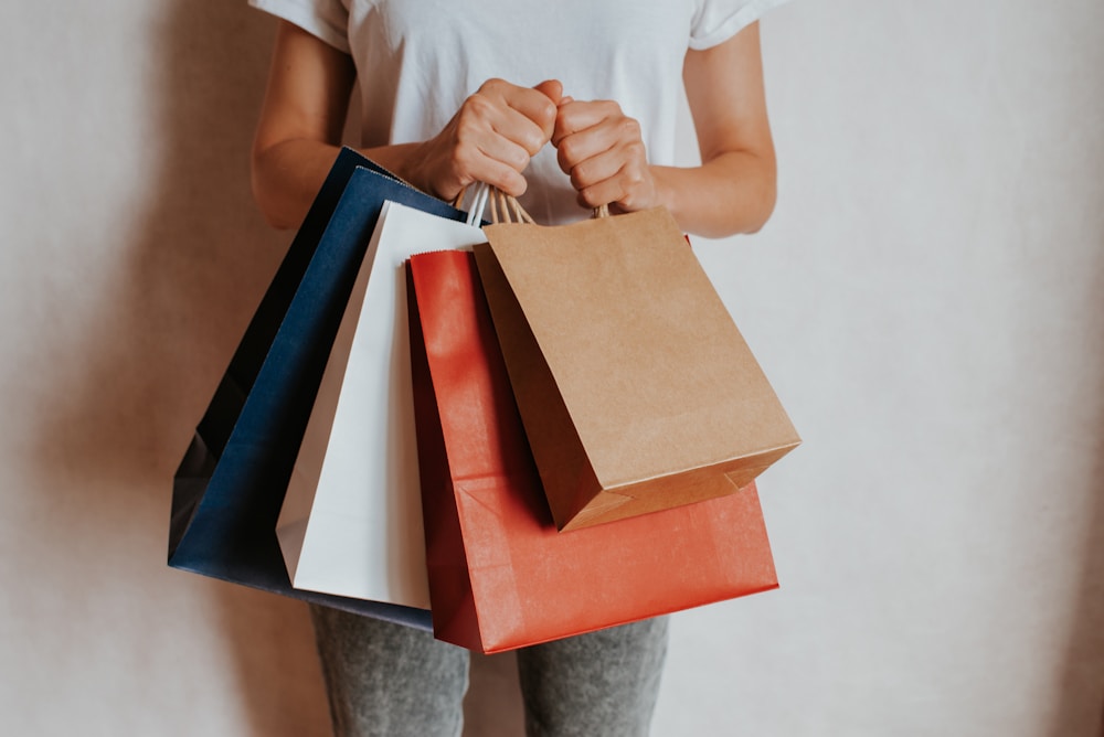 Customer holding colorful shopping bags